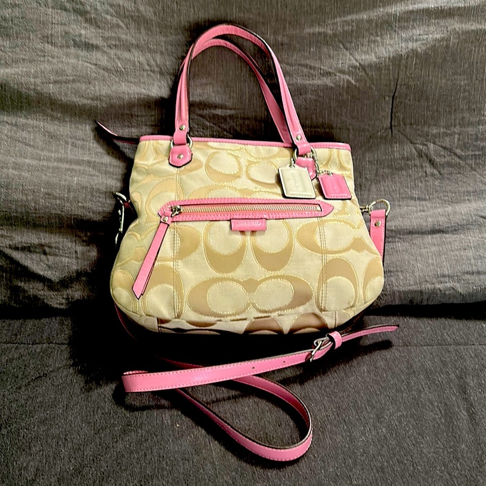 Pink and champagne coach bucket purse.